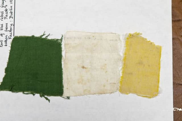 Handout photo dated 11/12/16 issued by Fennell Photography of a remnant of the Tricolour that flew over one of the frontlines in the 1916 Rising, as it has been donated to Glasnevin Cemetery. PRESS ASSOCIATION Photo. Issue date: Sunday December 11, 2016. The piece of flag has been in Jersey for the last 100 years after a native of the island and a member of the British Army's Jersey Pals Battalion climbed on to the roof of the Jacob's Biscuit Factory to take it down while under fire from rebel snipers. See PA story HISTORY Tricolour Ireland. Photo credit should read: Iain White/Fennell Photography/PA Wire

NOTE TO EDITORS: This handout photo may only be used in for editorial reporting purposes for the contemporaneous illustration of events, things or the people in the image or facts mentioned in the caption. Reuse of the picture may require further permission from the copyright holder.