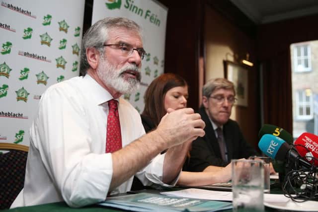Sinn Fein leader Gerry Adams (left) during a Sinn Fein press conference at the Davenport Hotel in Dublin at which Mr Adams was confronted by Austin Stack, whose prison officer father Brian was murdered by the IRA. Photo: Brian Lawless/PA Wire