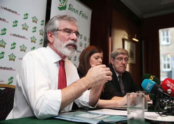 Sinn Fein leader Gerry Adams (left) during a Sinn Fein press conference at the Davenport Hotel in Dublin at which Mr Adams was confronted by Austin Stack, whose prison officer father Brian was murdered by the IRA. Photo: Brian Lawless/PA Wire