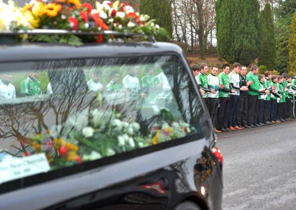 A guard of honour was formed by Fintona Pearse's GAA Club at the funeral of road crash vicitm Maurice McCloughan.