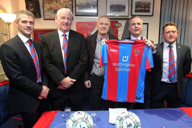 Left to right.  Darren Nixon, club chairman Brian Adams, club sponsor Huw Worthington, Colin Nixon and Warren Patton pictured at the Ards FC supporters club in Newtownards where they made the signing official.  

Picture by Jonathan Porter/Press Eye