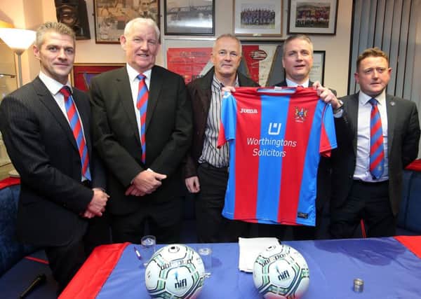 Left to right.  Darren Nixon, club chairman Brian Adams, club sponsor Huw Worthington, Colin Nixon and Warren Patton pictured at the Ards FC supporters club in Newtownards where they made the signing official.  

Picture by Jonathan Porter/Press Eye
