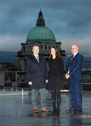 Paul Isherwood, left, director of asset management and Ian McCrickard, Belfast regional manager, NIHE, with Serena Hylands, asst MD, CTS