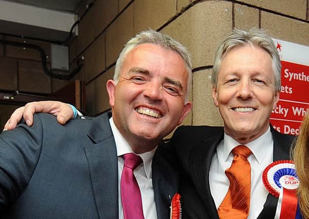 Jonathan Bell, left, who had been appointed by Peter Robinson, right, began working on a PhD about his then boss while he was a Stormont minister