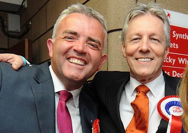Jonathan Bell, left,  was very close to Peter Robinson. They are seen here at an election count in Strangford in 2011. Picture Charles McQuillan/Pacemaker.