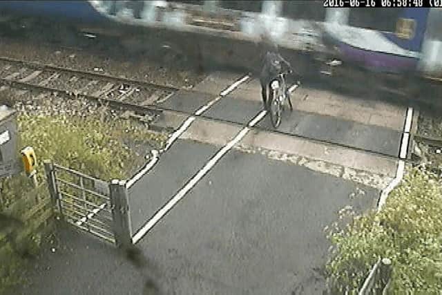 The near-miss was filmed by trackside cameras and CCTV on board trains as they passed the Ducketts level crossing in Pudsey, Leeds. Pic: PA