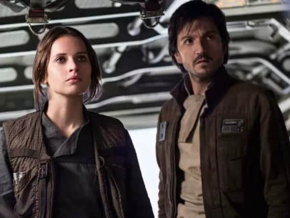 Felicity Jones as Jyn Erso and Diego Luna as Cassian Andor in Rogue One: A Star Wars Story