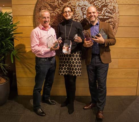 Brian Twomey, Elmagh Killeen and Mark Henry, of  Tourism Ireland, with some of the 20+ awards for the Game of Thrones campaign