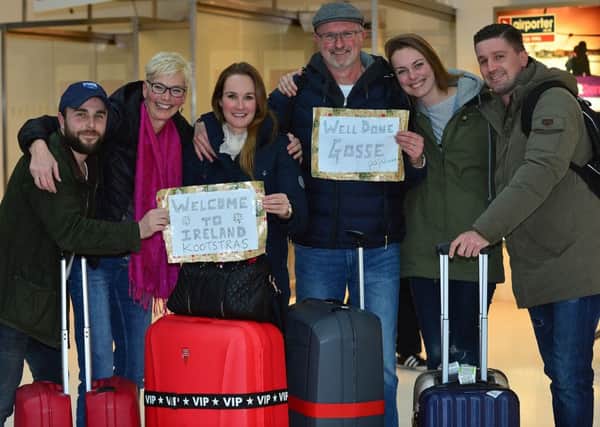 Christopher MacBlain from Banbridge (left) and Laureanne Kootstras from Amsterdam (second right) meet her family at the George Best Belfast City Airport on Friday. 
Picture: Arthur Allison/Pacemaker Press