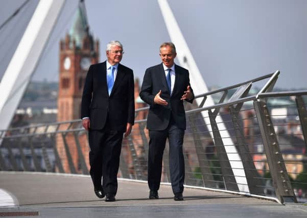 John Major and Tony Blair on the Peace Bridge above the Foyle during their visit to the city in June 2016.