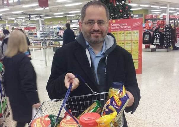 Steven Jaffe with a basket full of Israeli goods to be given to Christian charity.
