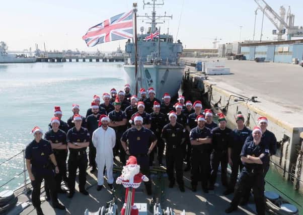 Photo issued by the Ministry of Defence of the crew of HMS Penzance in Bahrain, who have sent Christmas messages to their families.