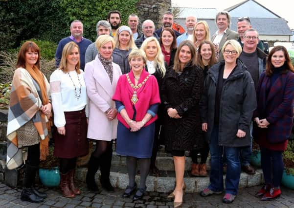 Local food producers who took part in the series of short films pictured with the Mayor of Causeway Coast and Glens Borough Council Maura Hickey, presenter Sarah Travers, representatives from Wolfhound Media and Louise McKinstrey from Tourism NI.