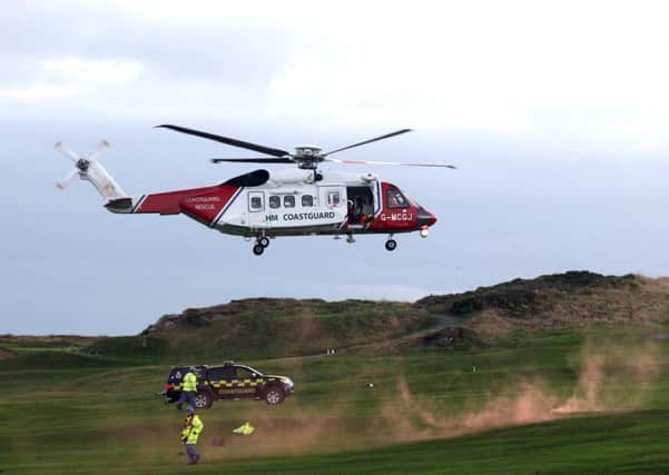 A Coastguard helicopter from Wales landing at Ardglass Golf Club after a golfer fell down a cliff face