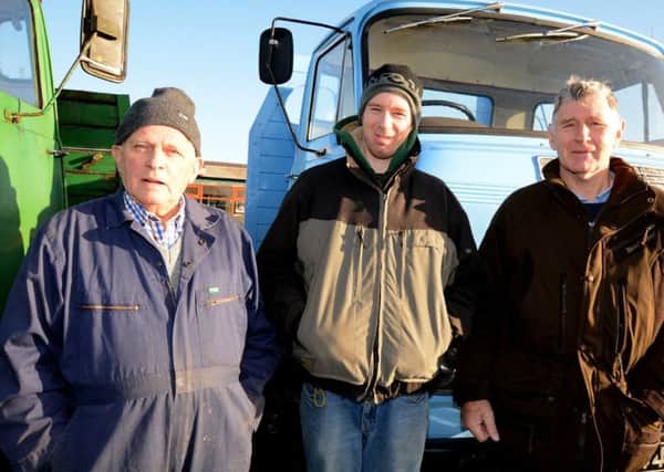 Gordon Clarke, David Corbett and William Corbett, brought along a pair of Commer vintage lorries to the  Boxing Day Tractor Run, in aid of the Southern Area Hospice and the Northern Ireland Cancer Fund for Children.  Picture: Gary Gardiner