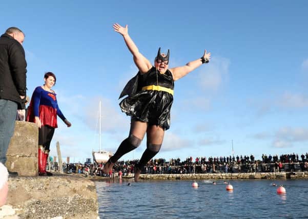 Angela McClements takes the plunge at the annual New Year's Day swim at Carnlough Harbour. 
Photograph By Declan Roughan / Press Eye
