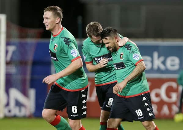 Glentoran's Nacho Novo (right) celebrates with his teammates after scoring to make it 0-2 at Shmrock Park. 

(Picture by Jonathan Porter/PressEye.com)