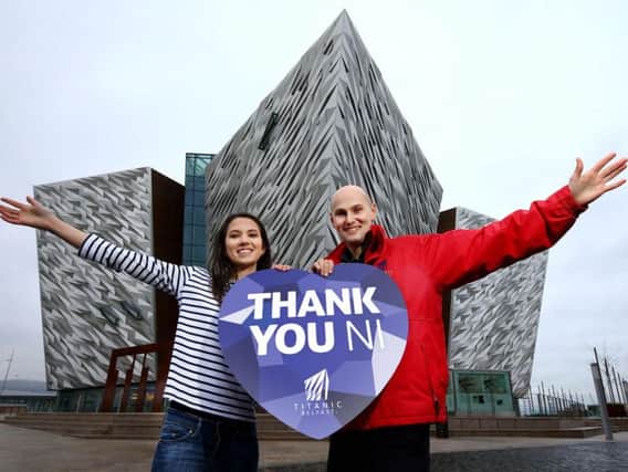 Sarah Matson (22) from Armagh and Titanic Belfast's Jonny Kelso celebrate Titanic Belfast's tourism success