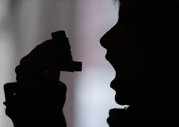 File photo dated 07/01/15 of a person using an inhaler, as millions of asthma patients are not receiving basic levels of care to keep their condition in check, Asthma UK has warned.  Photo credit: Yui Mok/PA Wire