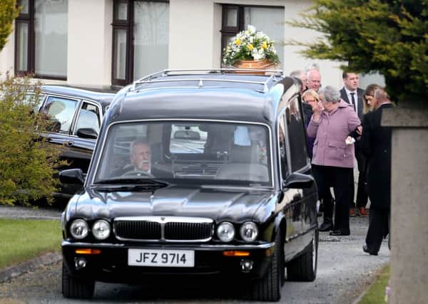 Mourners attend the funeral of William Stockdale