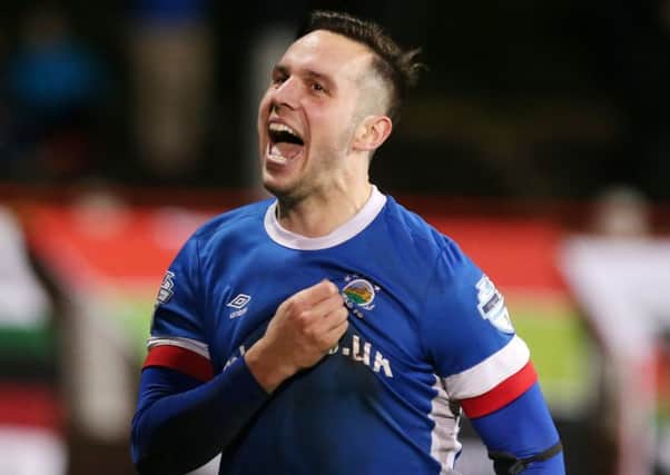 Linfield's Andrew Waterworth celebrates after he scores in extra time to make it 2-1 against Glentoran.