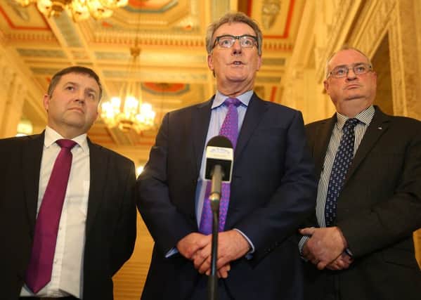Ulster Unionist MLA Robin Swann, leader Mike Nesbitt and Steve Aiken MLA at Stormont on Monday for RHI crisis