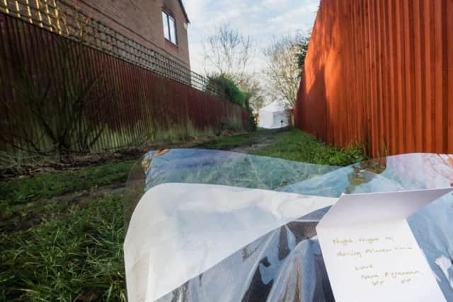 A floral tribute left by the grandparents of the victim in the Woodthorpe area of York, where a teenager was arrested Monday after the death of a seven-year-old gir