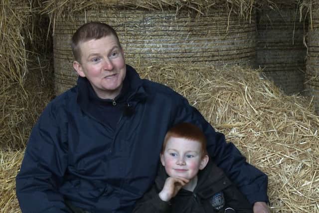 Tynan Roulston with son James in Bready, Co Tyrone