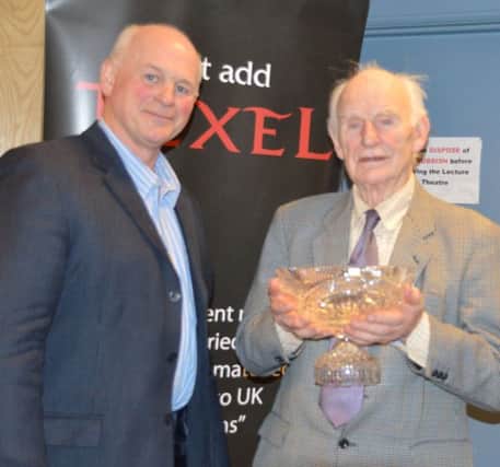 Mr Martin Cromie, NI Texel Club Chairman presents Robbie Mulligan with the Chairmans Trophy for his work and contribution to the Club.