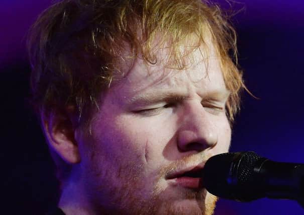 File photo 30/11/16 of Ed Sheeran, who did not realise his face had been cut open after he was allegedly struck with a ceremonial sword wielded by Princess Beatrice