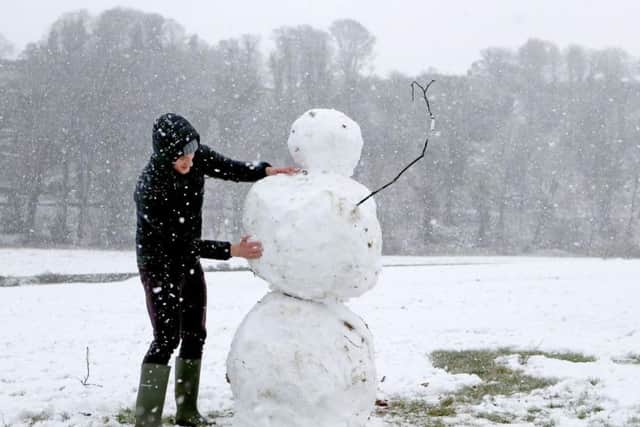Charlie Boldison building a snowman in Stirling, as blizzard conditions are set to sweep in, bringing "a real taste of winter to the whole of the UK"