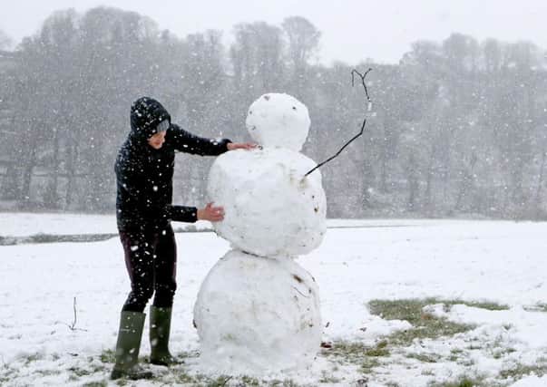 Charlie Boldison building a snowman in Stirling, as blizzard conditions are set to sweep in, bringing "a real taste of winter to the whole of the UK"