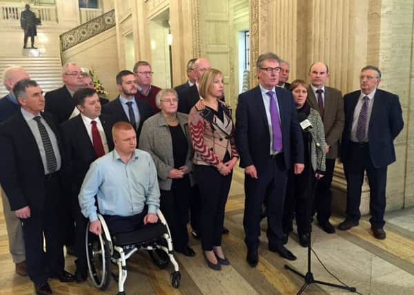 Ulster Unionist leader Mike Nesbitt addresses the media in Parliament Buildings, Stormont with UUP colleagues