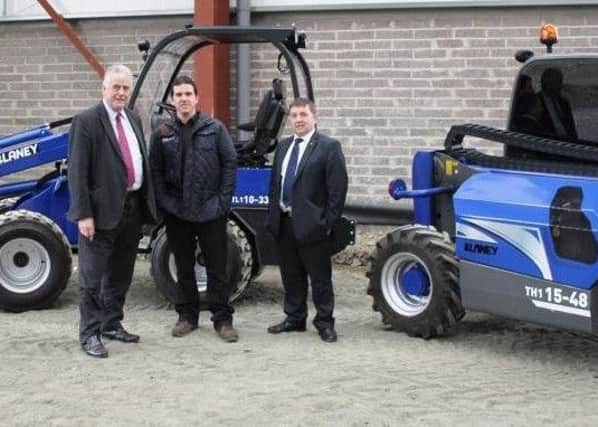 Jim Nicholson MEP, Sean Blaney and Robin Swann MLA pictured discussing the latest wheeled loaders made in Northern Ireland by Blaney Motor