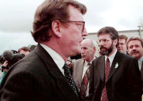 Ulster Unionist Party leader, David Trimble and Sinn Fein President, Gerry Adams pass within touching distance outside Castle  Buildings, Stormont during a break in the negotiations before the signing of the Good Friday Agreement in 1998. Pic by PACEMAKER