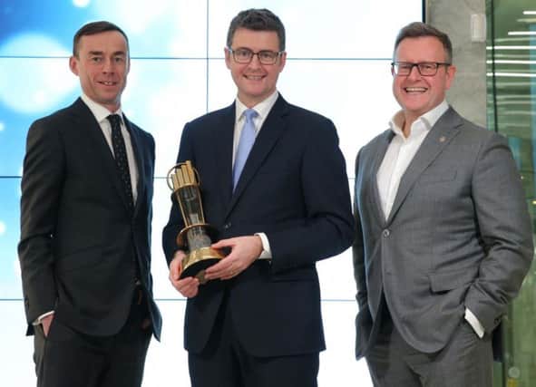 Robert Heron, tax partner with EY, with Brendan Mooney, CEO at Kainos and last years winner and Sean Duffy, EOY programme director
