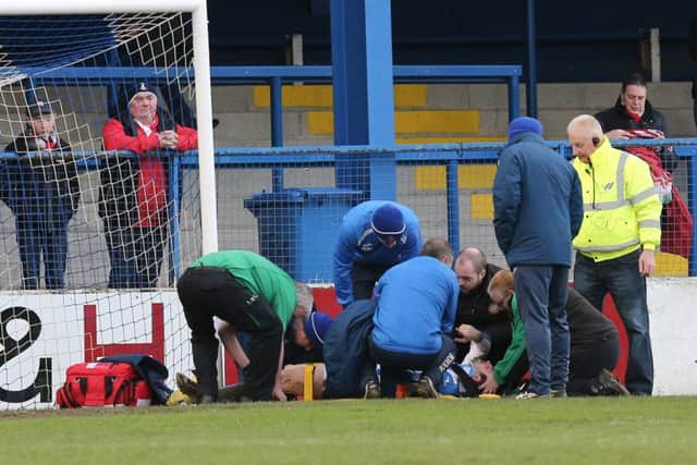 Pacemaker Belfast 14-1-17
Coleraine v Portadown - Danske Bank Premiership
Coleraine's Eoin Bradley lies injured after colliding with the post during today's game at Coleraine Showgrounds, Coleraine.  Photo by David Maginnis/Pacemaker Press