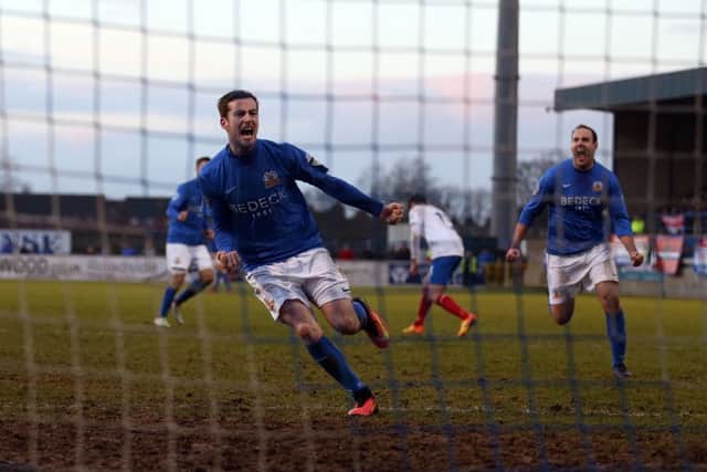 Glenavon's Andy McGrory celebrates scoring a penalty against   Linfield.