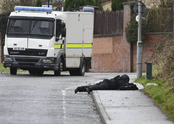 Police and ATO  at the scene of a security alert in the Brians Well Road area of west Belfast. 
Photo: Colm Lenaghan/Pacemaker Press