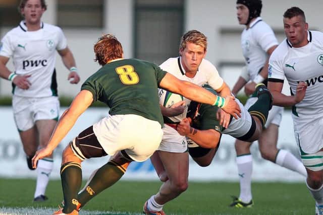 Ireland's Craig Gilroy comes up against Arno Botha of South Africa
 during the U20 World Cup in Italy in 2011