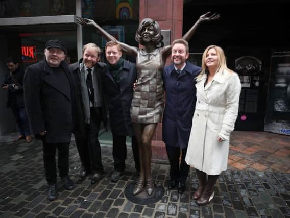 Artist Andy Edwards with Cilla Black's sons Ben, Jack and Robert Willis and artist Emma Rodgers by the statue of the singer at its unveiling outside the Cavern Club in Liverpool