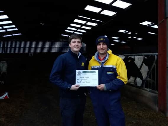 Michael Stewart presents David Boyd, Garvagh, with a Â£100 voucher for Fresh Start cow drink, sponsored by Premier Nutrition.