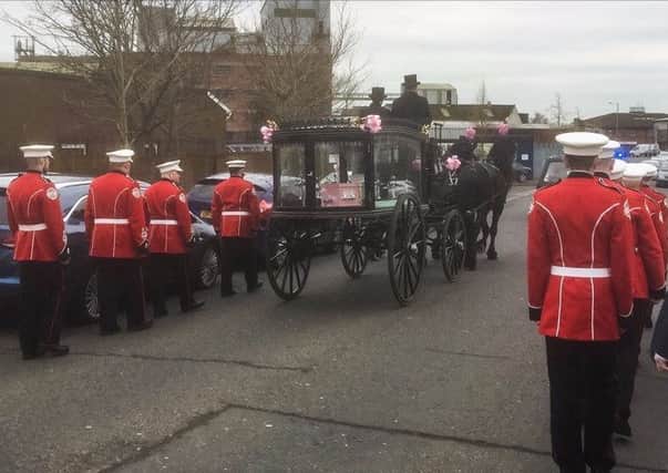 Dempsey's Ballantyne's coffin is carried to church by a horse drawn carriage