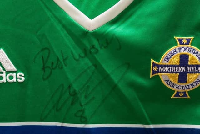 The Northern Ireland shirt signed by Steve Davis.
