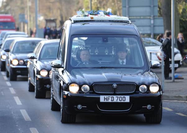 A hearse carrying the coffin of Status Quo guitarist Rick Parfitt arrives at Woking Crematorium for his funeral after he died on Christmas Eve