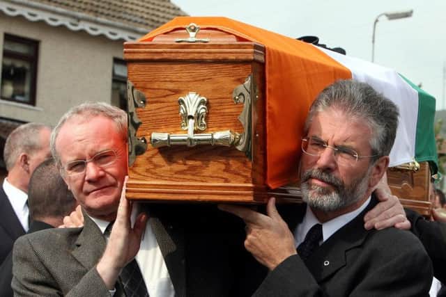 Martin McGuinness, left and Sinn Fein President Gerry Adams carrying the coffin of former senior IRA commander Brian Keenan in west Belfast in 2008. Photo: Paul Faith/PA Wire