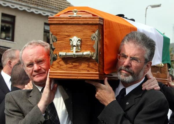 Martin McGuinness, left and Sinn Fein President Gerry Adams carrying the coffin of former senior IRA commander Brian Keenan in west Belfast in 2008. Republican and loyalist violence inflicted misery, yet Sinn Fein has used the Stormont crisis to continue to demand investigations into the small number of deaths caused by the security forces. Photo: Paul Faith/PA Wire