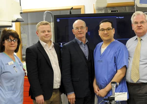 Patient Donie Cronin (centre) with clinical personnel, from left, Bernie McCallan, Dr Aaron Peace, Dr Godfrey Aleong and Dr Albert McNeill
