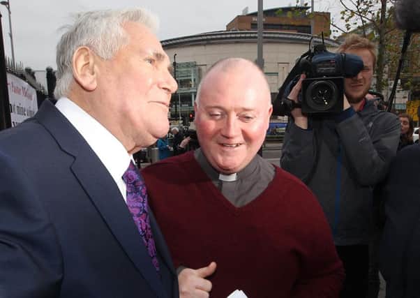 Fr Patrick McCafferty (centre) with Pastor Jim McConnell (left) in 2015 after the latter was cleared of making offensive remarks about Islam