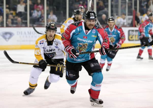 Belfast Giants' Brandon Benedict in action with Nottingham Panthers' Steve Lee at the SSE Arena.